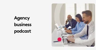 Team of three professionals working on laptops in an office setting.