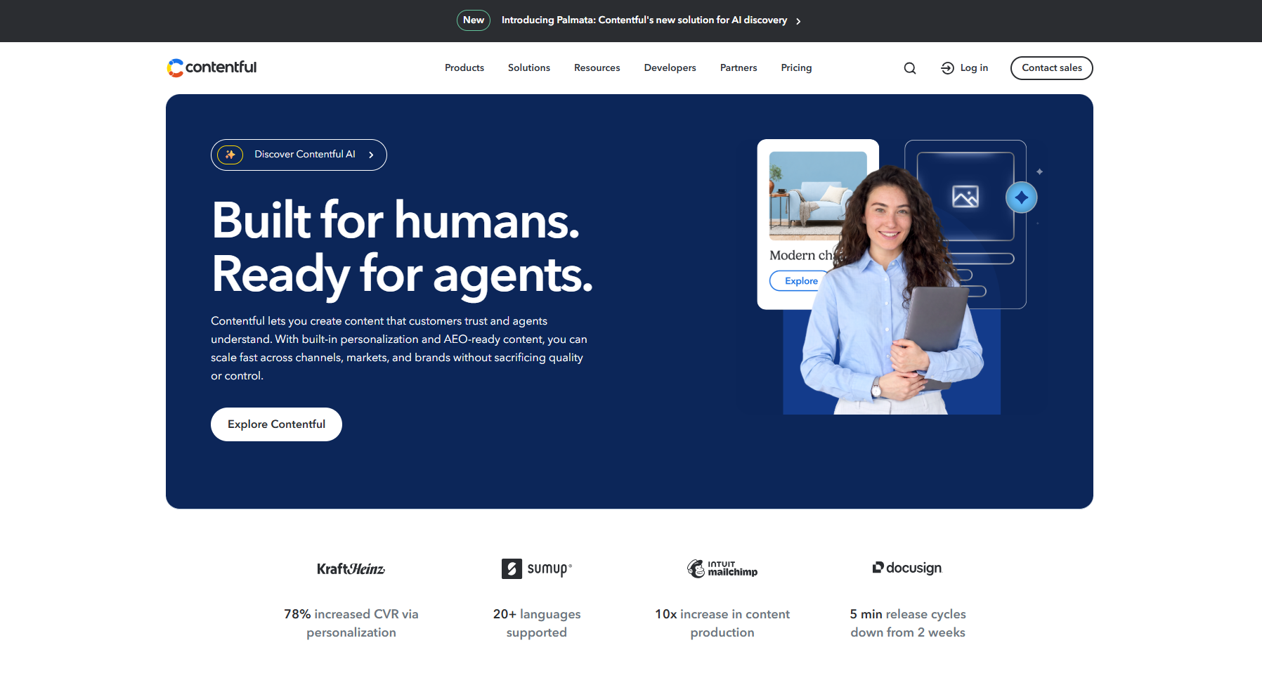 Contentful homepage banner with slogan 'Built for humans. Ready for agents.' and woman holding a laptop.