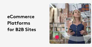 Businesswoman in warehouse using smartphone for B2B ecommerce platform.