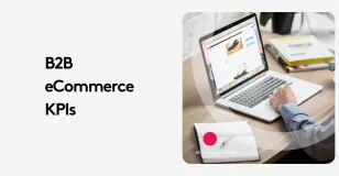 B2B eCommerce KPIs displayed on a laptop screen in a workspace setting.
