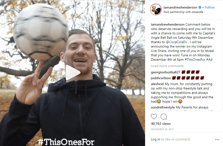 Man spinning a soccer ball on his finger in an autumn park.
