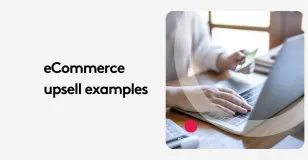 Person holding credit card and typing on laptop for ecommerce upsell examples.