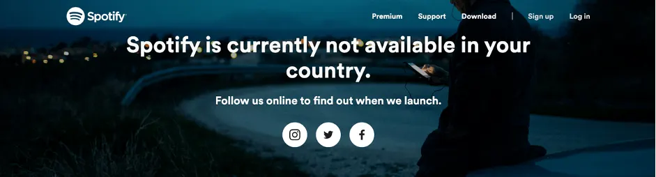 Spotify not available in your country message with night scene background