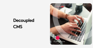 Hands typing on a laptop keyboard with the text 'Decoupled CMS' on the side.