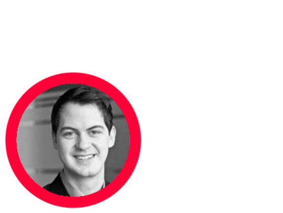 Smiling man in black and white with red circle border